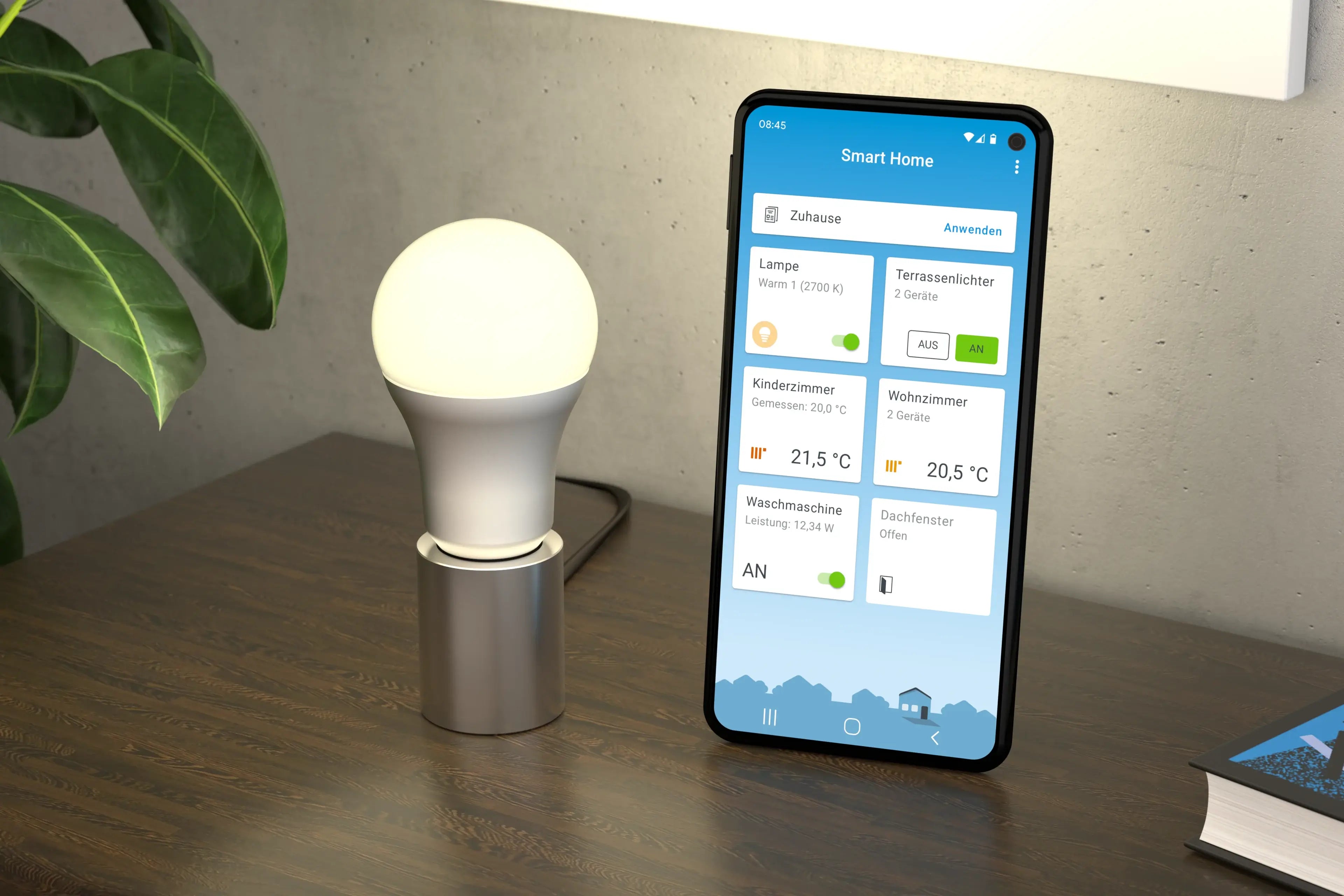 Smartphone zeigt intelligente Haussteuerung mit Lampe und Temperaturanzeigen auf einem Tisch.